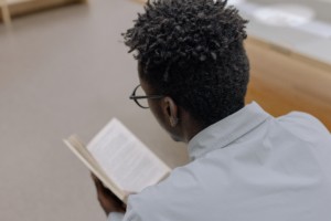 Young person reading a book
